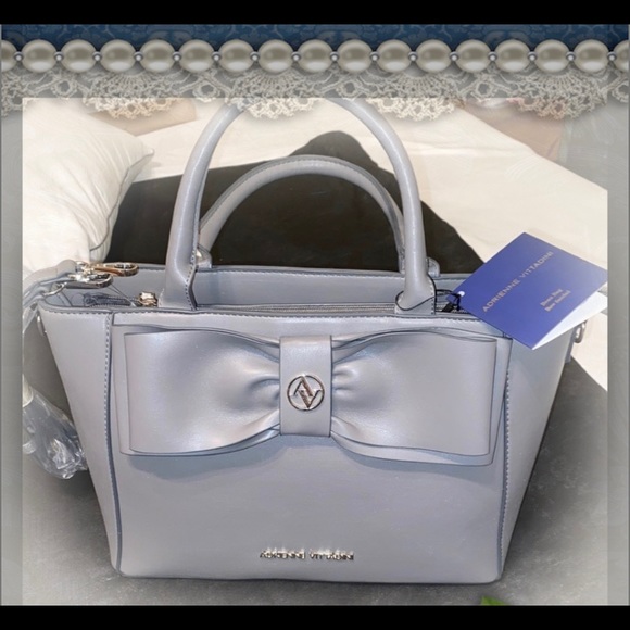 Purse with bow design on front. Brand new with tag. Gray purse. - Picture 3 of 16